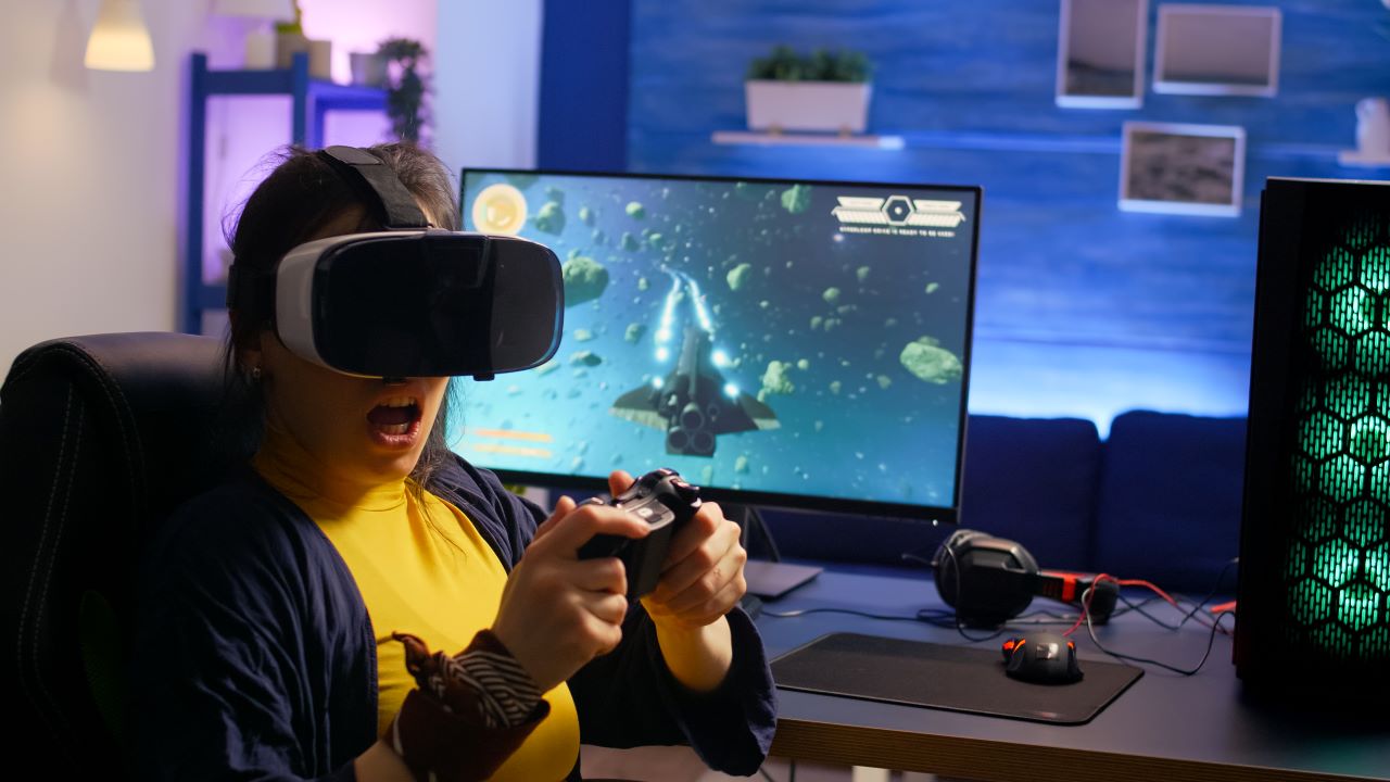 winner-gamer-wearing-virtual-reality-goggles-playing-space-shooter-video-games-room-with-rgb
